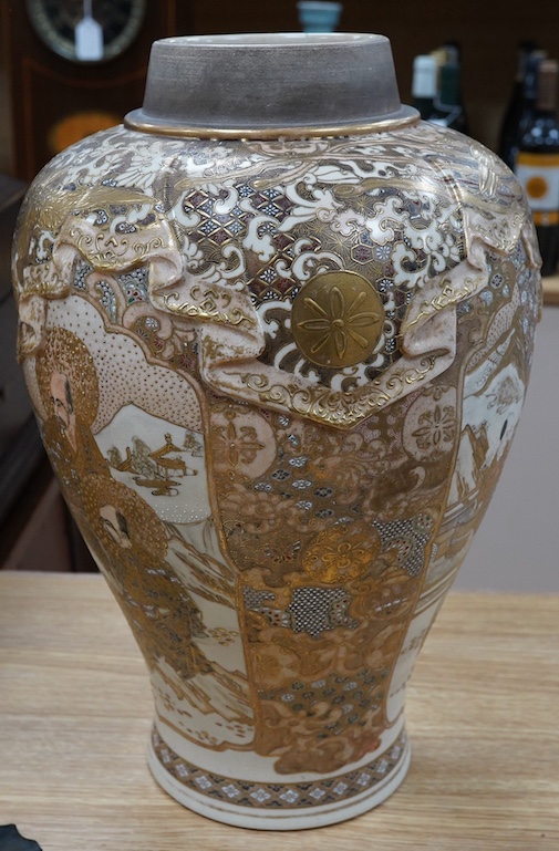 A large Japanese satsuma pottery vase, decorated in relief, Meiji period, 40cm high. Condition - fair